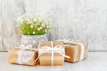 Beautifully wrapped gifts and white flowers