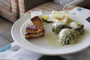 Traditional Fijian food: Rourou (taro leaves soaked in coconut milk) Balls with grilled fish and...