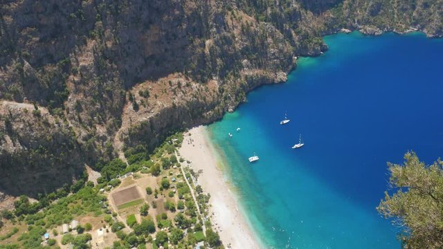 Two young woman enjoying beautiful view of The Butterfly Valley in Fethiye, Turkey