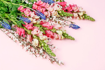 Pink matthiola and blue muscari flowers in one bouquet.