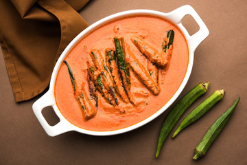 Hyderabadi Bhindi ka Salan or Okra salan made using ladies' fingers or ochro. Main course recipe from India. served in a bowl. selective focus