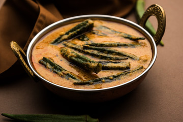 Hyderabadi Bhindi ka Salan or Okra salan made using ladies' fingers or ochro. Main course recipe from India. served in a bowl. selective focus