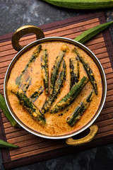 Hyderabadi Bhindi ka Salan or Okra salan made using ladies' fingers or ochro. Main course recipe from India. served in a bowl. selective focus