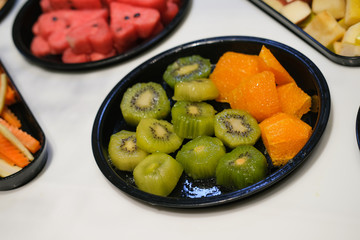 Kiwi slices on a plate for salad.
