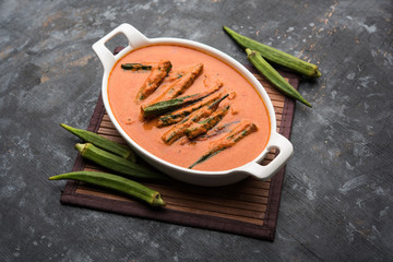 Hyderabadi Bhindi ka Salan or Okra salan made using ladies' fingers or ochro. Main course recipe from India. served in a bowl. selective focus