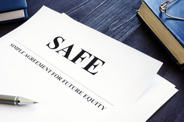 Simple agreement for future equity SAFE on the office desk.