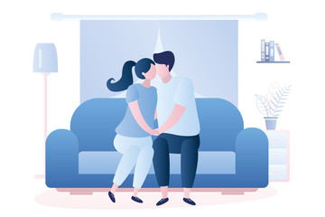 Couple in love sitting on the couch and kissing, living room interior with furniture.