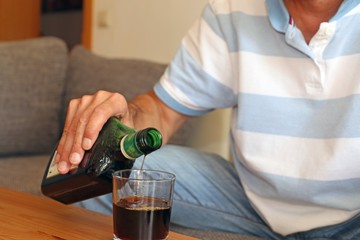 Man with drinking problems at home