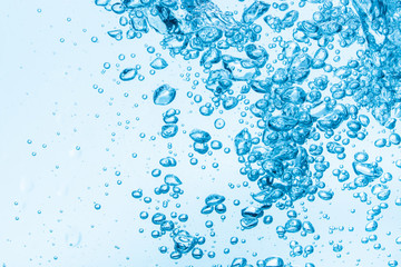 Fototapeta na wymiar Bubbles in blue water background.
