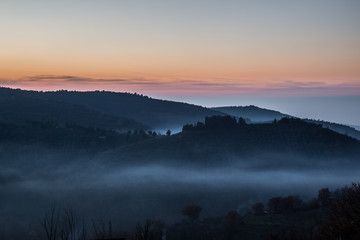 A view of Umbria valley with hills and mist