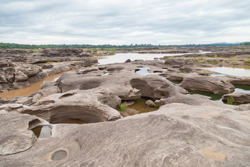 River Island. Rocks from water erosion. 