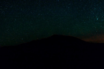 Night starry sky in the mountains. Background.