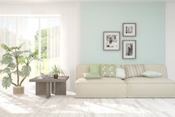 Stylish room in white color with sofa and summer landscape in window. Scandinavian interior design. 3D illustration
