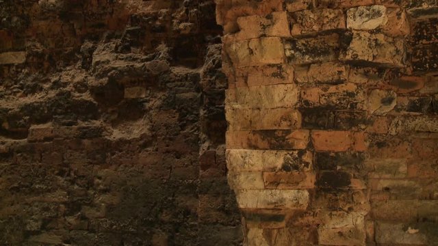 A closeup interior shot of the damaged brick walls inside the Khmer ruins of Sambor Prei Kuk located in the north of the city of Kampong Thom, Cambodia. 