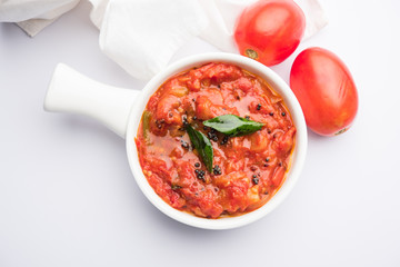 Tomato/tamatar chutney or sauce, served in a bowl. selective focus