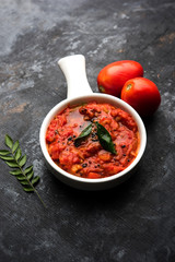 Tomato/tamatar chutney or sauce, served in a bowl. selective focus