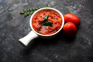 Tomato/tamatar chutney or sauce, served in a bowl. selective focus
