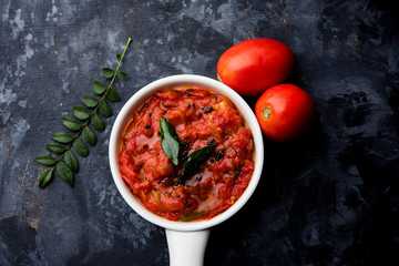 Tomato/tamatar chutney or sauce, served in a bowl. selective focus
