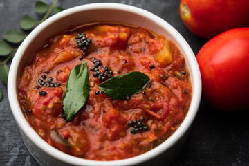 Tomato/tamatar chutney or sauce, served in a bowl. selective focus