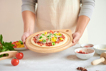 Obraz na płótnie Canvas Step-by-step boss makes a pizza margarita. Dough and pizza ingredients