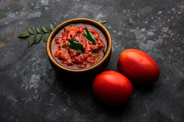 Tomato/tamatar chutney or sauce, served in a bowl. selective focus