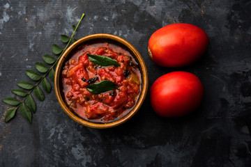 Tomato/tamatar chutney or sauce, served in a bowl. selective focus