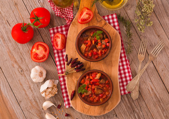 Marinated pork loin in tomato sauce.
