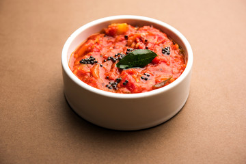 Tomato/tamatar chutney or sauce, served in a bowl. selective focus