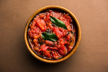 Tomato/tamatar chutney or sauce, served in a bowl. selective focus