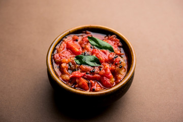 Tomato/tamatar chutney or sauce, served in a bowl. selective focus