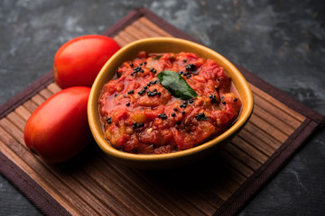 Tomato/tamatar chutney or sauce, served in a bowl. selective focus