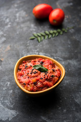 Tomato/tamatar chutney or sauce, served in a bowl. selective focus