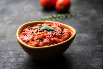Fototapeta na wymiar Tomato/tamatar chutney or sauce, served in a bowl. selective focus