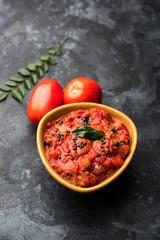 Tomato/tamatar chutney or sauce, served in a bowl. selective focus