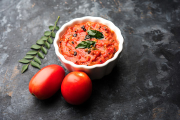 Tomato/tamatar chutney or sauce, served in a bowl. selective focus