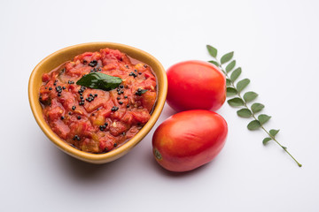 Tomato/tamatar chutney or sauce, served in a bowl. selective focus