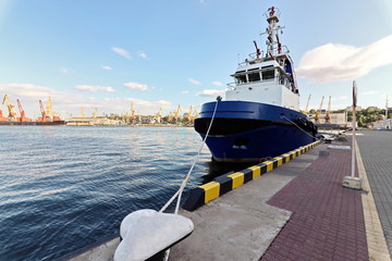 Views of container and cargo berths with sea vessels, tugs and yachts. Port Odessa, Ukraine. Summer 2019.