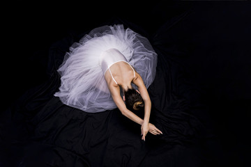 High angle ballerina on black background