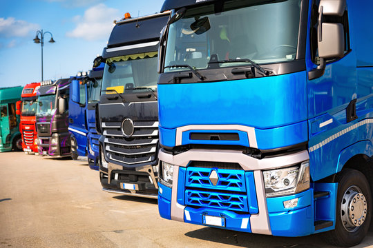 Close-up of various Semi Trucks, lined during truck show.