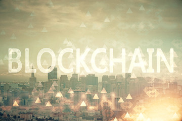 Double exposure of crypto currency theme hologram drawing and city veiw background. Concept of blockchain and bitcoin.