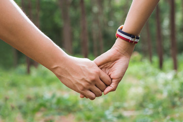 Man and Woman tourists handshake, The couple enjoyed a trip to the woods. Travel concept hiking camping holiday.