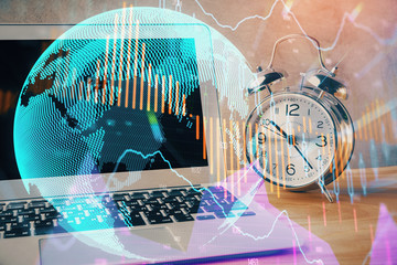 Double exposure of chart and financial info and work space with computer background. Concept of international online trading.