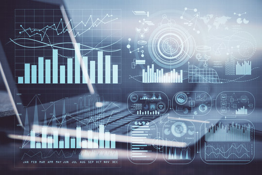 Financial graph colorful drawing and table with computer on background. Multi exposure. Concept of international markets.