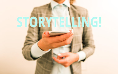 Word writing text Storytelling. Business photo showcasing activity writing stories for publishing them to public Business concept with mobile phone and business woman