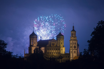 fireworks over the illuminated Augsburg Town Hall