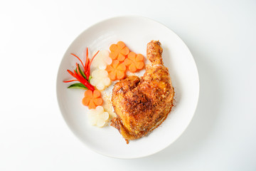 Hot and spicy baked chicken on white plate