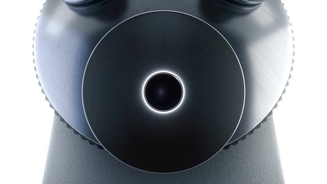 Close-up wide shot of scientific laboratory microscope changing its lenses while taking digital macro photo shots for microbiology, science, pharmaceutical research, medicine and chemistry industry