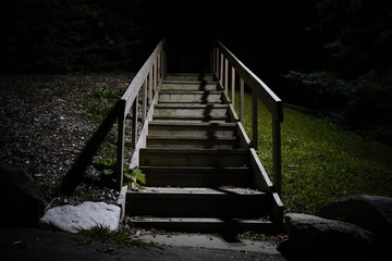 Wooden Stairway leads to the dark nothingness 