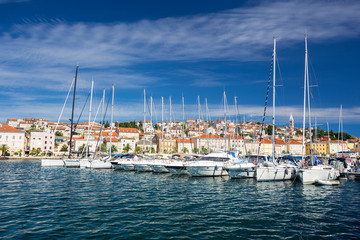 Fototapeta na wymiar yachts moored at the pier in harbour of Losinj town, Croatia.