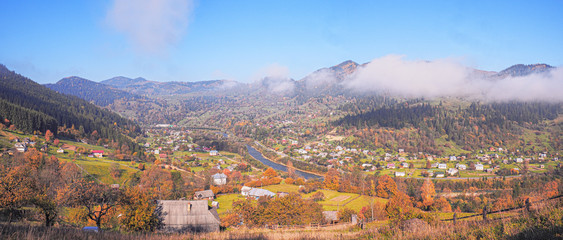 Carpatian village at mountains at the sunny day
